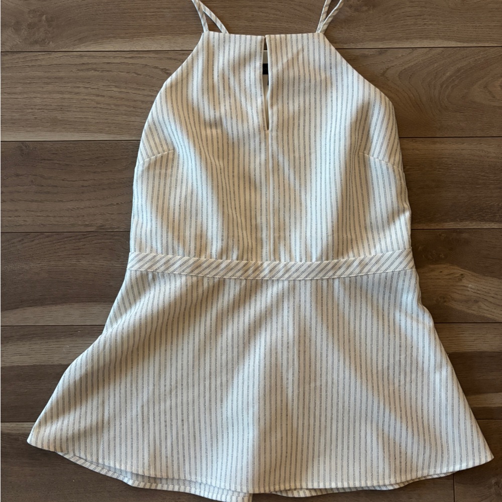White and navy striped peplum business casual tank